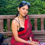 Anusha Viswanathan Instagram - All too well season. 🍁 . . . #september #alltoowell #swiftie #fall #heartbreak #love #red #saree #sareenotsorry #redsaree #parks #london #vacation #travel #endofsummer #summertan #autumncolours #aesthetic #fashion #music #magic #travelblogger #wanderlust #majormissing #nostalgia #hope #secret #fashionblogger #instablogger