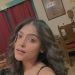Anusha Viswanathan Instagram - I can feel the long weekend creeping in. 🩵 . . . P.S: This dress is so me, dark but with flowers in it. 🙈 #vibes #feather #ootn #happy #mood #sass #trendingreels #feelitreelit #trendingaudio #jamming #vibing #fashion #beachcurls #longhair #love #danceitout #fashionblogger #aesthetic #myroom #music #instablogger #instareels