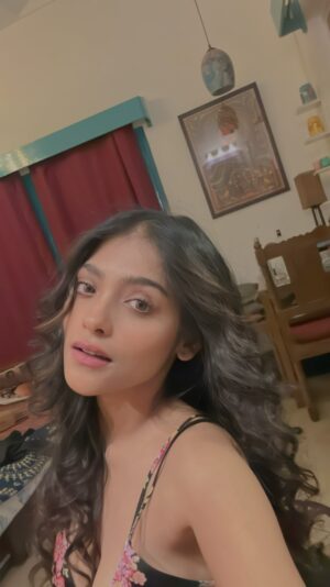 Anusha Viswanathan Instagram - I can feel the long weekend creeping in. 🩵
.
.
.
P.S: This dress is so me, dark but with flowers in it. 🙈
#vibes #feather #ootn #happy #mood #sass #trendingreels #feelitreelit #trendingaudio #jamming #vibing #fashion #beachcurls #longhair #love #danceitout #fashionblogger #aesthetic #myroom #music #instablogger #instareels