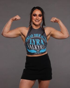 Aoife Cusack Instagram - First Lyra Valkyria shirt, available NOW on WWE shop! 🪶

@wweshop

📷@brutledge
💄@sgnicole