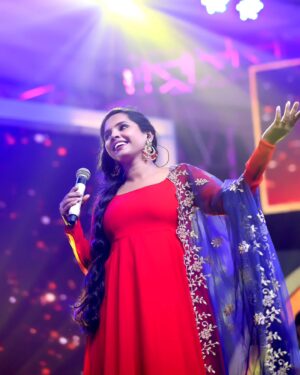 Aparna Narayanan Instagram - 🎤✨ Bringing the stage to life, one electrifying moment at a time! 🎶💃📸 These candid captures embody the pure bliss I feel when I'm performing for an incredible audience. 🙌❤️ 

Credits :
Photo - @magicmomentsphotography.in 
Costume - @_gina_couture 
Makeup & hair - @blushwithanki 
Earrings - @gina_fashionbling 

Also, it's raining red on my insta posts 😜

#performer #aparnanarayanan #stage #performance #singer #supersinger #ss9 #vijaytv #vijaytelevision #red #weekend #sunday #happy #love #musician