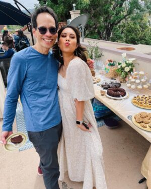 Ashley Argota Instagram - when all of your chosen family comes together for an LA baby shower extravaganza 🍼💕 we are so lucky to be surrounded by an incredible tribe of people who care and support us so deeply! 

@heidijarrettdance thank you for all of the time and effort and planning and love you put into our day!! you have been my family since i was 13 and it was so special to spend this time with all of you 💕
@ibedoom the floral arrangements were beyond my wildest dreams, thank you endlessly for the incredible work you put into this. and we met a month ago but you’re family now so you can’t get rid of me— sorry about it! 
thank you to my forever sisters @amandadrake & @terriannebutac for the drinks and party favors (they don’t even live in LA anymore you guys 🥹). 
thank you to my in laws for the extra hands and help and love, and for bringing hazel so didi had a friend all day. 
and thank you to our incredible friends for the gifts and love and words of encouragement as we get closer to meeting our baby boy. 💙 we love you all so much. now if you’ll excuse me i wore heels yesterday so i will be sitting w my feet up all week lololol