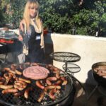 Ashley Rickards Instagram - Just me fake-grilling at a real phallic-free Polish sausage-party courtesy of @brianudovich