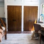 Ashley Williams Instagram - “My name’s Gus and I like small spaces,” my nine year old used to introduce himself to people this way. He loves reading, drawing, and “being cozy,” so when we considered designing a bedroom for him, the only answer was this mahogany treehouse vibe. We went to @roomandboard and had the best time designing exactly to his sensibility. He loves to sit at his desk and “imagine that I’m in the forest.” I’m obsessed with Room and Board’s sturdy, clean lined aesthetic and sometimes on stressful days I go hide in there myself. 😆 #homerenovation #kidsroom @we_are_kismet @alchemy_collective_ #roomreveal #ad
