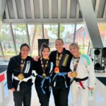 Ashley Yoder Instagram - It ain’t much but it’s honest work😂💀🙌🏽reallllly proud of our girls I know we missed @doykfam and her gold medal for the pic but way to go ladies🙏🏽♥️ me trying not to grab the gi is 🤣🤣🤣 thank you @rollpayments for always supporting me🔥