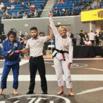 Ashley Yoder Instagram - It ain’t much but it’s honest work😂💀🙌🏽reallllly proud of our girls I know we missed @doykfam and her gold medal for the pic but way to go ladies🙏🏽♥️ me trying not to grab the gi is 🤣🤣🤣 thank you @rollpayments for always supporting me🔥