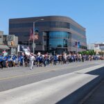 Ashly Burch Instagram – A picture of the Mere Mortals writers   unofficial mascot Cody out on the picket line from a few weeks ago. And a picture of the rally last Wednesday. We’re still out here, goin’ strong!