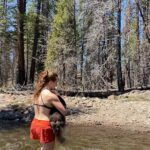 Aspen Ladd Instagram - We all need a little help sometimes 🙂 this is on today’s 11.5 mile hike . Kaia needs help to cross fast moving water like this ( she will be 14 this summer) it’s a privilege to still have old girl as my adventure buddy and enjoying her wild self ❤️ #seniordogsofinstagram #olddogsrule #womenwhohike #neverstopexploring