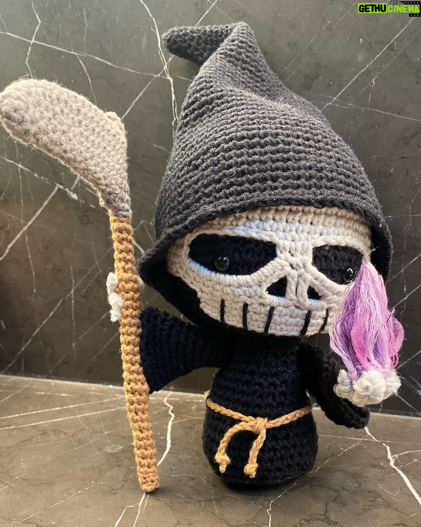 Athena Karkanis Instagram - Why do we fear death…? He’s adorable! Grim reaper pattern by @rokiki_ami. Purple fire was a special request. #crochetersofinstagram #amigurumi #amigurumist