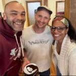 Audra McDonald Instagram - So after a day of crazy flights delayed, plane taken out of service, and racing through the airport to catch a new flight to a different city in Virginia and then renting a car and driving to the destination that we were originally supposed to fly to…my music director Andy and I finally made it to Charlottesville, VA for my concert last night. Andy and I were weary, exhausted, sleep deprived and had no idea what kind of performance we would give after the chaotic day of travel we had just endured. The audience in Charlottesville was so warm, energetic and loving. They completely lifted our spirits and made us feel at home and completely restored by the end of the concert! During my encore I asked the audience for a recommendation for a good place for a bakery to hit this morning before I headed out of town. Someone in the audience yelled out MarieBette’s Bakery and pointed to two lovely gentleman in the front row. Turns out the two lovely gentleman were owners of MarieBette’s and I asked if they had brownies. They were both so sweet and shy and said yes. So I stopped in this morning and when I tell you their bakery was gorgeous and filled with every amazing delicacy under the sun! And they had made me a gorgeous brownie torte with my FACE on it!!! What?!? Amazing. If you’re in Charlottesville you must stop by. Thank you Jason and Patrick. And thank you Charlottesville for restoring my spirit last night. Can’t wait to come visit your beautiful city again soon. 🙏🏾🙌🏾❤️🥮🧁🍰🏳️‍🌈 @mariebettecafe