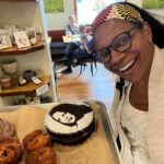 Audra McDonald Instagram - So after a day of crazy flights delayed, plane taken out of service, and racing through the airport to catch a new flight to a different city in Virginia and then renting a car and driving to the destination that we were originally supposed to fly to…my music director Andy and I finally made it to Charlottesville, VA for my concert last night. Andy and I were weary, exhausted, sleep deprived and had no idea what kind of performance we would give after the chaotic day of travel we had just endured. The audience in Charlottesville was so warm, energetic and loving. They completely lifted our spirits and made us feel at home and completely restored by the end of the concert! During my encore I asked the audience for a recommendation for a good place for a bakery to hit this morning before I headed out of town. Someone in the audience yelled out MarieBette’s Bakery and pointed to two lovely gentleman in the front row. Turns out the two lovely gentleman were owners of MarieBette’s and I asked if they had brownies. They were both so sweet and shy and said yes. So I stopped in this morning and when I tell you their bakery was gorgeous and filled with every amazing delicacy under the sun! And they had made me a gorgeous brownie torte with my FACE on it!!! What?!? Amazing. If you’re in Charlottesville you must stop by. Thank you Jason and Patrick. And thank you Charlottesville for restoring my spirit last night. Can’t wait to come visit your beautiful city again soon. 🙏🏾🙌🏾❤️🥮🧁🍰🏳️‍🌈 @mariebettecafe