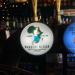 Becky James Instagram - I travelled to Africa to deliver Hardest Geezer a pint from his local pub. let’s be real, the man deserved a pint. huge thank you to russell and his team for allowing us to join such an mental mission, @the.goose.worthing pub for letting us literally steal a pint and james connor & charlie who went along with a very daft idea. 🤌🏼 peace, love, worthing pints X (don’t forget to donate what you can to russ - link in his bio @hardestgeezer)
