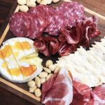 Becky Sauerbrunn Instagram - ‘Tis the season! Charcuterie boards are essential to any holiday gathering in my house. I’ve paired @VolpiFoods prosciutto (THE best textured prosciutto out there), coppa, and rosé wine salami with baked brie, crackers and grapes. Not sure what to put on your party board? The team at @VolpiFoods has created a guide for you! Visit volpifoods.com/entertain for more info. #sponsored