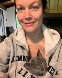 Bellamy Young Instagram - This made me smile, so I thought maybe it would you too...🥰 Made a cup of coffee & sat down to journal for a minute this morning. Razor was beside me as always, but my old man cat Button decided he wanted to be a part of the proceedings. He's gotten all sentimental in his old age & now does the sweetest things out of the blue. He jumped up in my lap, snuggled under my sweatshirt, popped his head out the top, & promptly fell asleep, his little purrs softly vibrating through me. 🥰 Hope you get some surprise love today too! I'm wishing you all the best! 🥰☕️📖😻❤️