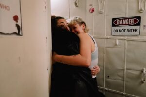 Betty Who Instagram - some moments from my last day at the Walter Kerr 😭🚂🍷
i am endlessly grateful i got to ride that train to the end of the line with my new and now forever family @hadestown 
i think it’s gonna take me a while to stop constantly running steps and songs in my head getting ready for that nights performance.
thank you to every single one of you who have supported me on this journey! it’s so vulny! to just… do something you have literally never done before and just hope you don’t embarrass yourself! so many of you have been sooo kind and reassuring. the way i have been gassed up at stage door by some of yall?!?!? and god bless my FRIENDS. you beautiful people. who have been so patient and gentle with me while this schedule has taken over my life.  i know shows are expensive and not everyone is a musical theatre nerd like me! the fact that so many of you travelled from far and wide to buy a ticket to Hell just to show up for me blows my mind. i love you all so much. 
sharing a closing night with @_solaylay will be a core memory for ever and ever. it’s rare at this age to connect with someone and feel like you’ve been friends since birth. that’s me and this silly goose! see u soon bean u’ll never be rid of me now!
finally just a lil note about @zcassar 
this man. this MAN!!! zak has been the most supportive partner to me in the last six months in a way i can’t really put words to. this lifestyle is hard, especially being away from home for as long as we have been. to imagine doing it without him seems impossible. not to mention sitting yesterday with him, going through the images he has captured of this part of my life. the way he sees the world is such beautiful art. he always says his best pictures are the ones he takes of people he loves. that’s why his best pictures are always of me 🥹😭😭😭 
this has been such a huge chapter. i have learned so much and am SO. GRATEFUL! if there’s one thing about me, it’s that i’m just a show girl at heart! 
HERE’S TO MORE SHOWS! MORE WIGS! MORE ADVENTURES IN THE THEATRE TO COME! ⭐️