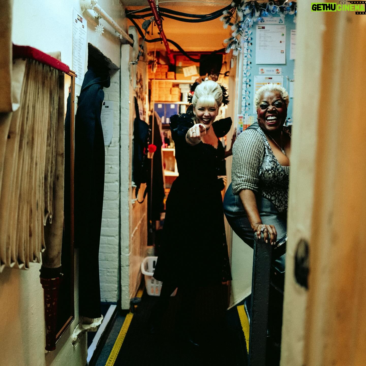 Betty Who Instagram - 5 left 👠🥀🖤 @hadestown these photos of me calling lillias down the stairs before we open act 2 together will never cease to remind me how CRAZY it is that i’ve gotten to share the stage with her. broadway legend Lillias f*cking White!!! i have learned so much and she makes me LAUGH. she doesn’t just sing, she channels. music feels better coming from her, it feels divine, it feels touched. like the way she’s singing it was what was written on the cosmic page all along. it’s been my absolute honour to learn from the best and call you my friend @lilliaswhiteofficial ❤️😭 i also love that Zak captured the hallway next to stage. it’s just. a hallway. decorated with love by our stage managers. yet it holds legends! awaiting their places call! legends who are about to change someone’s life on the other side of that hallway. idk man. i love the theatre.