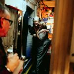 Betty Who Instagram - 5 left 👠🥀🖤 @hadestown these photos of me calling lillias down the stairs before we open act 2 together will never cease to remind me how CRAZY it is that i’ve gotten to share the stage with her. broadway legend Lillias f*cking White!!! i have learned so much and she makes me LAUGH. she doesn’t just sing, she channels. music feels better coming from her, it feels divine, it feels touched. like the way she’s singing it was what was written on the cosmic page all along. it’s been my absolute honour to learn from the best and call you my friend @lilliaswhiteofficial ❤️😭 i also love that Zak captured the hallway next to stage. it’s just. a hallway. decorated with love by our stage managers. yet it holds legends! awaiting their places call! legends who are about to change someone’s life on the other side of that hallway. idk man. i love the theatre.