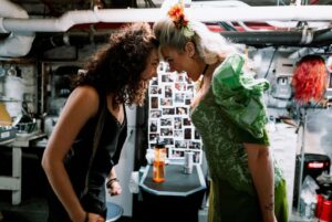 Betty Who Instagram - some moments from my last day at the Walter Kerr 😭🚂🍷
i am endlessly grateful i got to ride that train to the end of the line with my new and now forever family @hadestown 
i think it’s gonna take me a while to stop constantly running steps and songs in my head getting ready for that nights performance.
thank you to every single one of you who have supported me on this journey! it’s so vulny! to just… do something you have literally never done before and just hope you don’t embarrass yourself! so many of you have been sooo kind and reassuring. the way i have been gassed up at stage door by some of yall?!?!? and god bless my FRIENDS. you beautiful people. who have been so patient and gentle with me while this schedule has taken over my life.  i know shows are expensive and not everyone is a musical theatre nerd like me! the fact that so many of you travelled from far and wide to buy a ticket to Hell just to show up for me blows my mind. i love you all so much. 
sharing a closing night with @_solaylay will be a core memory for ever and ever. it’s rare at this age to connect with someone and feel like you’ve been friends since birth. that’s me and this silly goose! see u soon bean u’ll never be rid of me now!
finally just a lil note about @zcassar 
this man. this MAN!!! zak has been the most supportive partner to me in the last six months in a way i can’t really put words to. this lifestyle is hard, especially being away from home for as long as we have been. to imagine doing it without him seems impossible. not to mention sitting yesterday with him, going through the images he has captured of this part of my life. the way he sees the world is such beautiful art. he always says his best pictures are the ones he takes of people he loves. that’s why his best pictures are always of me 🥹😭😭😭 
this has been such a huge chapter. i have learned so much and am SO. GRATEFUL! if there’s one thing about me, it’s that i’m just a show girl at heart! 
HERE’S TO MORE SHOWS! MORE WIGS! MORE ADVENTURES IN THE THEATRE TO COME! ⭐️