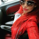Bianca Beauchamp Instagram - I drive a Dodge Challenger Rally Redline. Do you like muscle cars as I do? #musclecar #leather #subglasses #ride #dodge #redhead
