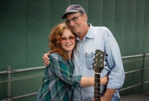 Bonnie Raitt Instagram - Happy Birthday, @jamestaylor_com! Miss you and love you more than Sweet Potato Pie! ❤️ ❤️ 
 
Photo by @michaelivins backstage at @fenwaypark, August 2015.
