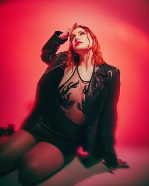 Bree Essrig Instagram - I feel like dynamite, I feel like dying toniiiight 🧨 

📸 by the one and only @savannarruedy 

#sleighbells #locustlaced #redheadmodel