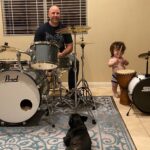 Briana Renee Instagram - Happy Valen-time’s with my handsome Valentine’s 💙🤘🏻 How we celebrate : Go to @guitarcenter, buy a drum set for my most deserving hubby, eat some pizza (him) and a sandwich (moi); then enjoy the night with drum play and snuggles 💙 Maverick has found his “spark” 🥁 #happyvalentinesday #Manningstyle #myhandsomes #truelove #letsmakemusictogether #musical #therealreasonifellinlovewithhim 😘