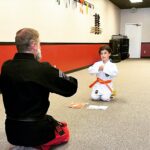 Briana Renee Instagram - Leiana is kicking a** and taking names💪🏻👊🏻 She earned her orange belt, and is ready to begin training for purple.. all after finishing 7th grade with a 3.89 GPA🤘🏻#futureblackbelt #mastersdegree ♥️ #proudmom #theskyisthelimit