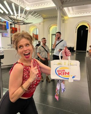 Bridget Everett Instagram - Brought my new signature accessory to @biglarreon678’s warm and wonderful show. I guess the question is, “who wore it best?” I not only model, but I also model. Larry is an incredible visual artist and designer but also one of my favorite songwriters. Where I’m from, we call that “too much talent!” Thanks for asking me to sing with you and @jimandralismusic. Family, right?