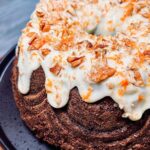 Briony May Williams Instagram - Spice up your life with this next delicious instalment in my Super Seasonal Recipe Series ❤️ This time we’re celebrating the humble carrot 🥕 This Spiced Carrot Bundt Cake is so packed with flavour and takes the carrot cake to the next level. I’ve made a Bundt but you can use a loaf tin for this recipe 🥕 Let me know if you give this gorgeous cake a try! ❤️ #seasontotaste Ingredients 320g carrots, grated 100g pecans, chopped 100g raisins 300g plain flour 2 tsp bicarbonate of soda 2 tsp ground cinnamon 1 tsp allspice 1 tsp ginger 1 tsp salt 300ml vegetable oil 4 large eggs 1 tsp orange extract 200g golden caster sugar 200g light brown sugar Icing 150g cream cheese 100g icing sugar 2 tbsp lemon juice Decoration Crushed pecans Orange zest Method 1. Oven on to 180C fan/200C. Liberally grease and flour a bundt tin. 3. In a bowl, add the oil, eggs, orange extract and sugars. Mix well to combine. 4. In another bowl, add the flour, bicarb, cinnamon, allspice, ginger and salt. Whisk to combine. 5. Tip the oil mixture into the flour mixture. Mix until smooth. Add the grated carrots, nuts and raisins. Mix again then pour into the prepared tin. Bake for 1h10 until a skewer comes out clean. Leave for 10 minutes then tip onto a cooling rack. 6. Make the icing. Mix all the ingredients together until smooth then drizzle over the cake. Sprinkle over the crushed pecans. #recipe #bundt #homebaking #homebaker #baker #baking #carrot #carrotcake #bundtcake #seasonal #easyrecipes #spicedcake #cakegoals