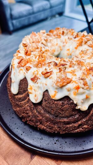 Briony May Williams Instagram - Spice up your life with this next delicious instalment in my Super Seasonal Recipe Series ❤️ This time we’re celebrating the humble carrot 🥕 This Spiced Carrot Bundt Cake is so packed with flavour and takes the carrot cake to the next level. I’ve made a Bundt but you can use a loaf tin for this recipe 🥕 Let me know if you give this gorgeous cake a try! ❤️ #seasontotaste

Ingredients
320g carrots, grated
100g pecans, chopped
100g raisins
300g plain flour
2 tsp bicarbonate of soda
2 tsp ground cinnamon
1 tsp allspice
1 tsp ginger
1 tsp salt
300ml vegetable oil
4 large eggs
1 tsp orange extract
200g golden caster sugar
200g light brown sugar

Icing
150g cream cheese
100g icing sugar
2 tbsp lemon juice

Decoration
Crushed pecans
Orange zest

Method
1. Oven on to 180C fan/200C. Liberally grease and flour a bundt tin.
3. In a bowl, add the oil, eggs, orange extract and sugars. Mix well to combine.
4. In another bowl, add the flour, bicarb, cinnamon, allspice, ginger and salt. Whisk to combine.
5. Tip the oil mixture into the flour mixture. Mix until smooth. Add the grated carrots, nuts and raisins. Mix again then pour into the prepared tin. Bake for 1h10 until a skewer comes out clean. Leave for 10 minutes then tip onto a cooling rack.
6. Make the icing. Mix all the ingredients together until smooth then drizzle over the cake. Sprinkle over the crushed pecans.

#recipe #bundt #homebaking #homebaker #baker #baking #carrot #carrotcake #bundtcake #seasonal #easyrecipes #spicedcake #cakegoals