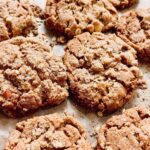 Briony May Williams Instagram - PLEASE TAKE CARE WITH THIS RECIPE , YOU MAY EAT THE WHOLE LOT!!! The latest instalment in my seasonal recipe series are these Apple Crumble Cookies which are ridiculously delicious, I should be humble but I just can’t with these, they really are superb and crumbly and yummy😍 If you thought the Apple Crumble Cake was good, have a gander at these beauties 🍎#seasontotaste Ingredients Cookies 125g unsalted butter, softened 250g biscoff spread 125g golden caster sugar 175g light soft brown sugar 1 large egg 275g self raising flour 25g custard powder (optional) ½ tsp salt 2 red apples, cored and chopped Crumble coating 75g self raising flour 50g unsalted butter, chilled and cubed 50g granulated sugar 50g rolled oats 1 tsp cinnamon 1 tbsp Demerara sugar Method 1. Oven on to 180°C fan/ 200°C. Line 2 baking trays with parchment. 2. Make the crumble. In a mixing bowl, rub the butter into the flour until it resembles breadcrumbs then mix through the sugar, oats and cinnamon. 3. Make the cookie dough. Beat the butter, biscoff spread and sugars until light and fluffy. 4. Add the egg into the butter mixture and beat until combined. 5. Add the flour, custard powder and salt then gently mix until combined. Add the chopped apple and mix until just combined. 6. Break off a brussel sprout size piece of cookie dough and roll into a ball. Place each ball of dough in the crumble to coat. Place on the parchment and top with extra crumble. Sprinkle over the Demerara sugar. 7. Bake for 15 minutes until golden brown. Enjoy! #recipe #seasonal #seasonalfood #apple #applecrumble #cookies #yummy #delicious #tasty #homebaking #baking #cakedecorating #homebaker #dessert #bakery #edible #cookierecipe #bestcookiesever #mouthwatering #ingredient #easyrecipes #foodideas #dessertrecipe #instruction