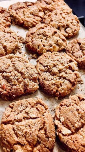 Briony May Williams Instagram - PLEASE TAKE CARE WITH THIS RECIPE , YOU MAY EAT THE WHOLE LOT!!! The latest instalment in my seasonal recipe series are these Apple Crumble Cookies which are ridiculously delicious, I should be humble but I just can’t with these, they really are superb and crumbly and yummy😍 If you thought the Apple Crumble Cake was good, have a gander at these beauties 🍎#seasontotaste 

Ingredients
Cookies
125g unsalted butter, softened
250g biscoff spread
125g golden caster sugar
175g light soft brown sugar
1 large egg
275g self raising flour 
25g custard powder (optional)
½ tsp salt
2 red apples, cored and chopped

Crumble coating
75g self raising flour 
50g unsalted butter, chilled and cubed
50g granulated sugar 
50g rolled oats
1 tsp cinnamon
1 tbsp Demerara sugar 

Method

1. Oven on to 180°C fan/ 200°C. Line 2 baking trays with parchment.
2. Make the crumble. In a mixing bowl, rub the butter into the flour until it resembles breadcrumbs then mix through the sugar, oats and cinnamon.
3. Make the cookie dough. Beat the butter, biscoff spread and sugars until light and fluffy.
4. Add the egg into the butter mixture and beat until combined. 
5. Add the flour, custard powder and salt then gently mix until combined. Add the chopped apple and mix until just combined.
6. Break off a brussel sprout size piece of cookie dough and roll into a ball. Place each ball of dough in the crumble to coat. Place on the parchment and top with extra crumble. Sprinkle over the Demerara sugar.
7. Bake for 15 minutes until golden brown. Enjoy!

#recipe #seasonal #seasonalfood #apple #applecrumble #cookies #yummy #delicious #tasty #homebaking #baking #cakedecorating #homebaker #dessert #bakery #edible #cookierecipe #bestcookiesever
#mouthwatering #ingredient #easyrecipes #foodideas #dessertrecipe #instruction