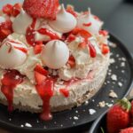Briony May Williams Instagram – Fancy whipping up a blooming delicious summery no bake pudding that is minimal effort, maximum taste?!? Look no further!!! Try this No Bake Eton Mess Cheesecake 🍓It is a beauty!!!! 

No Bake Eton Mess Cheesecake

Ingredients
200g chocolate chip digestive biscuits
75g unsalted butter, melted
400g cream cheese
150g icing sugar
250ml double cream
1 teaspoon vanilla extract
3 tbsp smooth strawberry jam

To top
150g strawberries
Meringue kisses
150ml double cream
3 tbsp smooth strawberry jam

Method
Bash the biscuits up using a rolling pin. Pour into a bowl then add the melted butter and mix. Pour into an 8 inch loose bottom cake tin. Place in the freezer for 10 minutes.
Place the jam in the microwave for 10 seconds to loosen. In a bowl,  whisk together the icing sugar and cream cheese. Pour the double cream and vanilla into another bowl and whisk to soft peaks then gently fold in 2 tablespoons of the strawberry jam. Fold together the cream cheese mixture with the whipped cream mixture until combined. Pour over the biscuit base then swirl through the remaining tablespoon of jam. Place in the fridge for a few hours or overnight to chill. 
To finish, remove the cheesecake from the tin. Whip the double cream until stiff peaks then divide into 2 bowls and fold a tablespoon of the jam through one of them. Hull and chop the strawberries. Top the cheesecake with the whipped creams, chopped strawberries, meringue kisses then drizzle over the remaining jam. 

#seasontotaste #strawberries #nobake #nobakecheesecake #nobakedessert #seasonalfood #seasonal