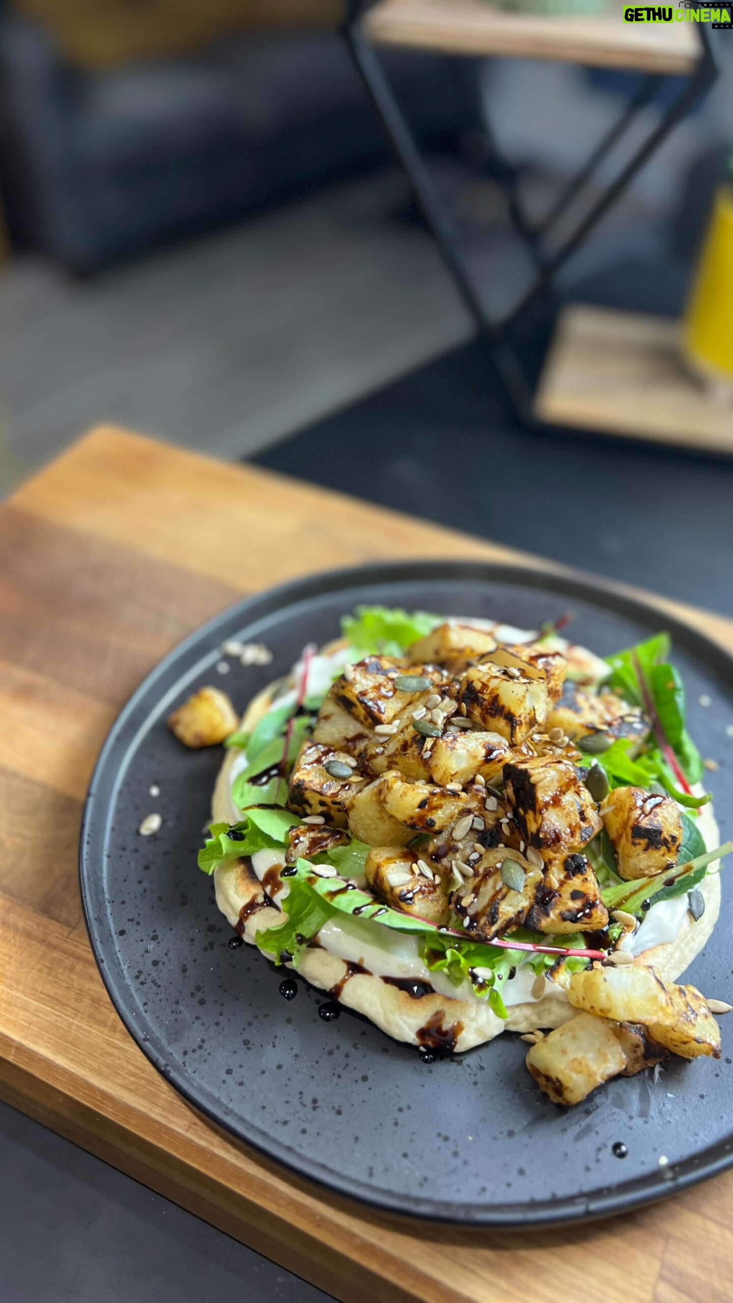 Briony May Williams Instagram - Today’s episode from my seasonal recipes series features the often overlooked, never the belle of the ball…the humble celeriac ❤️ This Spiced Celeriac on a Yogurt Flatbread is so yummy and delights the tastebuds with hints of mixed spice combined with the nuttiness of the celeriac. Trust me, it’s delicious!!! #seasontotaste Spiced Crispy Celeriac on Yogurt Flatbread Serves 2 Ingredients 1 celeriac 1 tbsp olive oil 1 tsp cornflour 1 tsp mixed spice 1 tsp cumin Flatbread 200g self raising flour 200g greek yogurt Yogurt Dressing 2 tbsp greek yogurt 1 tbsp honey/agave syrup ½ tsp mixed spice ½ tsp cumin To serve (optional) Salad leaves Mixed seeds Balsamic glaze Method Peel and chop the celeriac into 3cm chunks. Place in a pan of boiling water and a pinch of salt and cook for 6-7 minutes then drain. While the celeriac is boiling, make the dough. Mix the flour and yogurt together with a generous seasoning of salt and pepper to form a soft dough. Knead for a minute then form into a ball and set aside to rest for 5 minutes. Make the dressing by mixing the ingredients together in a bowl until combined. Make the bread by slicing the dough in half and roll each half out on a floured surface into a circle roughly ¼ inch thick. Heat a frying pan with a drizzle of olive oil, once hot add the dough and cook for 3 minutes then flip and cook the other side for a further 3 minutes. Cook until each side is golden brown and the bread is cooked through. Repeat with the other half of the dough. Place the drained celeriac in a bowl and drizzle over the olive oil. Mix. Combine the cornflour, mixed spice and cumin then sprinkle over the celeriac and mix well to coat. Heat a drizzle of olive oil in a pan, once hot add the coated celeriac and cook for 10-15 minutes until crispy on the outside and tender on the inside. Place flatbread on a serving dish. Spread over half the dressing, top with salad leaves and the crispy celeriac. Drizzle over the balsamic glaze, sprinkle the seeds then enjoy! #seasonal #season #celeriac #recipe #yummy #delicious #easycooking #easymeals #healthy #vegetarian #vegan #plantbased #lunchideas #lunch #bread #flatbread
