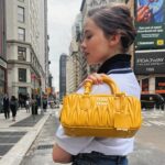Cailee Spaeny Instagram - NYC with my #MiuArcadie 💛🗽 @miumiu #miumiu