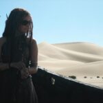 Camilla Belle Instagram - And this photo was found ! Evolet rocking the sunglasses in the middle of the Namibian sand dunes ! 😎✌️#tbt #bts