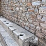 Camille Anderson Instagram - Turkey 🇹🇷 One of the more interesting places I’ve traveled to! We spent time in Kusadasi and toured the ancient city of Ephesus, along with Virgin Mary’s final home. Interesting Facts: 🔴Ephesus was constructed in 6th century BC, and its excavated remains reflect centuries of history, from classical Greece to the Roman Empire. It was once the second largest city of the Roman Empire and was an important trading hub. 🔴The Temple of Artemis is one of the Seven Wonders of the World. Ephesus is even referenced several times in the Bible. 🔴Mary, mother of Jesus, spent her last days near Ephesus. We visited Mary’s house nearby. It was really moving to experience such an important piece of history, first hand. 🔴 Pictured: Temple of Artemis, Ephesus Stadium (for sports activities, ceremonies and wild animal fights!), Goddess Nike, their toilette system-wild!, medical symbol (same as what we use today), Virgin Mary’s House plus our candle lighting and prayer placement ➡️ Thank you to our fantastic guide, Eda. Did you know that in Turkey, in order to be a guide, you must have a university degree in the specialty, speak multiple languages, and have proper licensing!? ➡️ I hope you enjoyed your history lesson! Xo