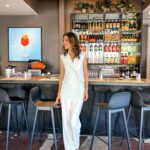 Candace Nelson Instagram - Let’s talk style in business... 👇🏻 It’s no secret that when you feel confident in what you’re wearing, that confidence shines through in everything you do. Take, for instance, my red power suit on @sharktankabc. 👠🦈 Not only did the red suit make me feel powerful, but it also became a part of my personal brand. It’s now synonymous with my time on Shark Tank, instantly recognizable and iconic. Now, fast forward to this past week ⏩ Packing for a week in Houston filled with restaurant opening events, TV appearances, and speaking engagements was no small feat. So I opted for a series of separates that were both chic and practical! When I’m working at the restaurant, comfort is key. Feeling confident in my clothes means feeling comfortable in them, especially since I need to be able to move freely. What staple pieces in your wardrobe make you feel like a boss? 😍💪🏻 (Styling: @ofthemomnt, @veronicabeard, @twpclothing, @staud.clothing, @sandroparis, @simkhai, @favorite.daughter, @lagencefashion, @maisonalaia, @tanyataylor, @kule, @twpclothing) • #styleoftheday #entrepreneurship #entrepreneurstyle #fitcheck #fitstagram #entrepreneurjourney #entrepreneurminds #candacenelson #pizzana #styleinspiration #dressforsuccess #confidenceboost #businessstyle #womeninbusiness #womeninbiz