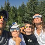 Candace Nelson Instagram - ⏮️ Throwback to the solar eclipse of 2017 🌒 It was a perfect day in Sun Valley without a cloud in the sky, and we were lucky to be in the path of totality. I remember everything getting very quiet and cool - almost chilly - on this hot August day. It became progressively dark and as the sun slipped behind the moon entirely, a cheer erupted from a neighboring watch party, echoing across the valley. It was a magical and awe inspiring event. Who is excited to watch today? ✋🏻 Ps: why do eclipse glasses have to be so goofy looking? #solareclipse #solareclipse2024 #familytime #candacenelson #entrepreneurwomen