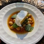 Cariba Heine Instagram - A year ago today, we had a most delectable meal cooked for us by Simon Jones. Very special day. Swipe for food shots. We had homemade foccacia and butter, mozzarella and tomato salad, cacio e pepe risotto, toothfish and butter beans, steak and a mind-blowing peppercorn sauce, "thrice-cooked" potatoes and delicious greens. Dessert was a chocolate cremeux with caramel, popcorn, raspberries and lime zest 🤤 10/10 menu.