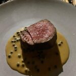 Cariba Heine Instagram - A year ago today, we had a most delectable meal cooked for us by Simon Jones. Very special day. Swipe for food shots. We had homemade foccacia and butter, mozzarella and tomato salad, cacio e pepe risotto, toothfish and butter beans, steak and a mind-blowing peppercorn sauce, "thrice-cooked" potatoes and delicious greens. Dessert was a chocolate cremeux with caramel, popcorn, raspberries and lime zest 🤤 10/10 menu.