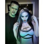 Carla Harvey Instagram – Happy Halloween from 1313 Mockingbird Lane 🎃 Channeling our inner Munsters 🖤We had so much fun recreating our favorite spooky couple last week with the help of @trooperhelmet 🧟‍♂️Swipe for all treats, no tricks 😜Thank you @cnelsonfx @nickmarrastudios @superstitchous_co #everydayishalloween #munsters #lilymunster #hermanmunster #yvonnedecarlo