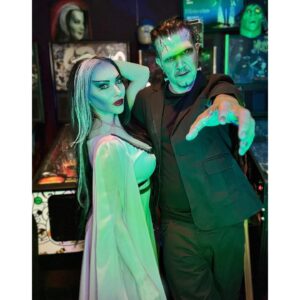 Carla Harvey Instagram - Happy Halloween from 1313 Mockingbird Lane 🎃 Channeling our inner Munsters 🖤We had so much fun recreating our favorite spooky couple last week with the help of @trooperhelmet 🧟‍♂️Swipe for all treats, no tricks 😜Thank you @cnelsonfx @nickmarrastudios @superstitchous_co #everydayishalloween #munsters #lilymunster #hermanmunster #yvonnedecarlo