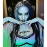 Carla Harvey Instagram – Happy Halloween from 1313 Mockingbird Lane 🎃 Channeling our inner Munsters 🖤We had so much fun recreating our favorite spooky couple last week with the help of @trooperhelmet 🧟‍♂️Swipe for all treats, no tricks 😜Thank you @cnelsonfx @nickmarrastudios @superstitchous_co #everydayishalloween #munsters #lilymunster #hermanmunster #yvonnedecarlo