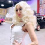Carla Harvey Instagram - MEOW! HOLY PINK! Behold the Panthermobile! I got a chance to hang out in the The infamous Pink Panther limo 💗This beauty was originally built by Bob Reisner but purchased by Galpin Motors in 2011 and completely restored by super rad @daveshuten of Galpin speed shop. Hair by @macdoll5150 I’m obsessed! Can't wait to see these photos @djimagery 🤩galpinmotorsports #pinkpanther #californiashowcar #panthermobile #bobreisner #daveschuten