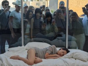 Carlota Guerrero Instagram - Before the opening of our current pop-up in Los Angeles, we curated a performative installation featuring our friend and muse Kiko Mizuhara. Inspired by the vibrant culture of celebrity that defines the city, we aimed to explore the inner world of pop icons, delving into their experiences of hypervigilance and the pervasive nature of idealization.

The setting of this installation captures the allure and complexity of celebrity culture. Amidst the space, a woman sleeps, her presence contrasting with the city’s pulse. Yet, even in her repose, she becomes a focal point, an object of fascination for those who pass by.

Conceptualized and documented by Carlota Guerrero, the piece is part of her extensive repertoire and exploration of the female gaze. Through her work, she delves into the complexities of how women perceive themselves and are perceived by others, encouraging reflection on the vulnerability and constant exposure inherent in the female experience.