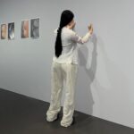 Carlota Guerrero Instagram - “Sofia Willendorf” Silicon, hair and clay (2022) @staatsgaleriestuttgart #carlotaguerrero “An apparent visitor stands serenely in a corner of the exhibition room. She has her back turned to the rest of the viewers and looks down towards a small figurine she holds with one of her hands. Titled Sofia Willendorf, the installation takes the historian and anthropologist LeRoy McDermott and Catherine Hodge's thesis from their article Decolonizing Gender: Female Vision in the Upper Paleolithic (1996) as the starting point. In the text, the authors criticize the way the first images of human bodies, the Venus figurines, have generally been interpreted “as sex objects made from a male point of view”. Instead, they argue, they were made by women and for women as a form of self-representation. Following this, the apparent distortions of the anatomy of the figurines become apt renderings if we consider the body as seen by a woman, presumably pregnant, looking down on herself. Regardless of the veracity of the argument —which seems perfectly logical and credible— the question remains; why did it take so long to consider the logical possibility that a female point of view was involved? Sofia Willendorf gives voice to that pregnant woman in the contemporary context, where past and present archetypes are confronted under the veil of an imposed male gaze the artist tries to subvert. A certain discomfort emerges while staring at the duo, ironically separated by 30,000 years gap. Originally purchased as a sex doll manufactured in China, the contemporary visitor cheerlessly exemplifies both the prevalence and the profound influence of the patriarchy." text and curation @marionavaldestorrella