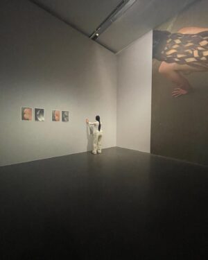 Carlota Guerrero Instagram - “Sofia Willendorf”
Silicon, hair and clay (2022) @staatsgaleriestuttgart #carlotaguerrero 

“An apparent visitor stands serenely in a corner of the exhibition room. She has her back turned to the rest of the viewers and looks down towards a small figurine she holds with one of her hands. 

Titled Sofia Willendorf, the installation takes the historian and anthropologist LeRoy McDermott and Catherine Hodge's thesis from their article Decolonizing Gender: Female Vision in the Upper Paleolithic (1996) as the starting point. In the text, the authors criticize the way the first images of human bodies, the Venus figurines, have generally been interpreted “as sex objects made from a male point of view”. Instead, they argue, they were made by women and for women  as a form of self-representation. Following this, the apparent distortions of the anatomy of the figurines become apt renderings if we consider the body as seen by a woman, presumably pregnant, looking down on herself.
 
Regardless of the veracity of the argument —which seems perfectly logical and credible— the question remains; why did it take so long to consider the logical possibility that a female point of view was involved?
 
Sofia Willendorf gives voice to that pregnant woman in the contemporary context, where past and present archetypes are confronted under the veil of an imposed male gaze the artist tries to subvert. A certain discomfort emerges while staring at the duo, ironically separated by 30,000 years gap. Originally purchased as a sex doll manufactured in China, the contemporary visitor cheerlessly exemplifies both the prevalence and the profound influence of the patriarchy."

text and curation
@marionavaldestorrella
