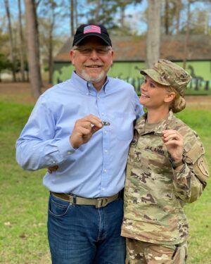 Carly Schroeder Instagram - My Dad is holding his wings that are more than 30 years old... Some little girls wanna grow up and be a princess or a mermaid. I wanted to be Airborne like my Papa.
.
I’m so grateful both my parents came to watch me jump and graduate. #airborne #familytraditions #bloodwings #airborneinfantry