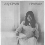 Carly Simon Instagram – I forgot all about that first photo, have you ever seen this photo of me?! 🎪🎠
This was 1974, photographed by Ed Caraeff for my album Hotcakes 🥞